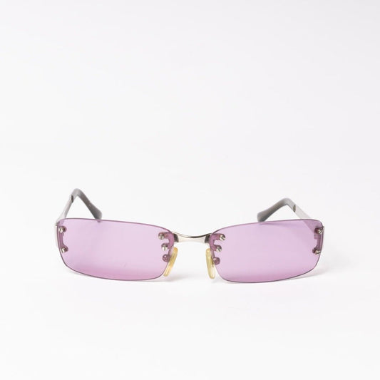 Step back in time with vintage purple Moschino sunglasses. Add a pop of color and retro flair to your style. Shop now