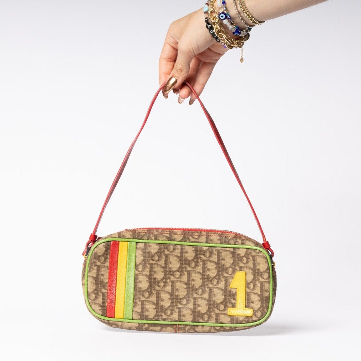 Elevate your fashion game with  iconic Dior Rasta Bag.