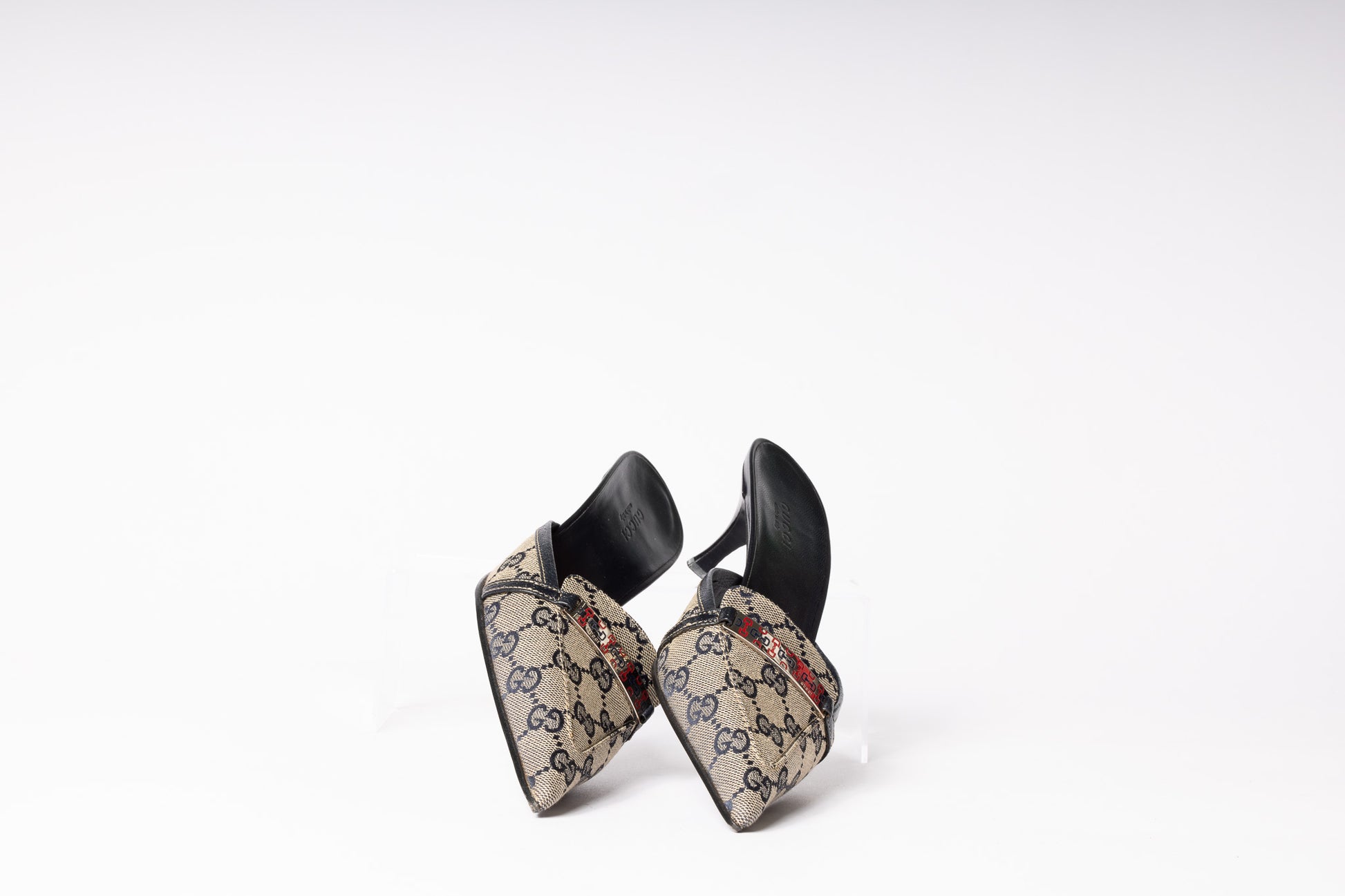 Vintage Gucci Mules - Classic elegance and iconic style in luxurious footwear for a timeless fashion statement.