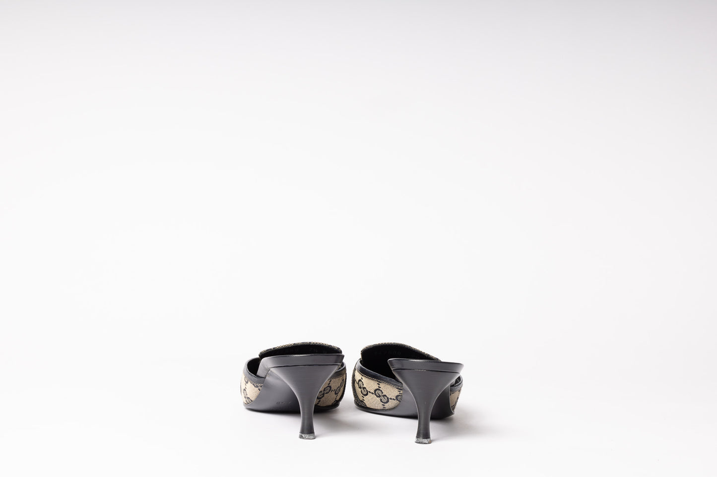 Vintage Gucci Mules - Timeless sophistication and iconic style in luxurious footwear for a fashion-forward look.
