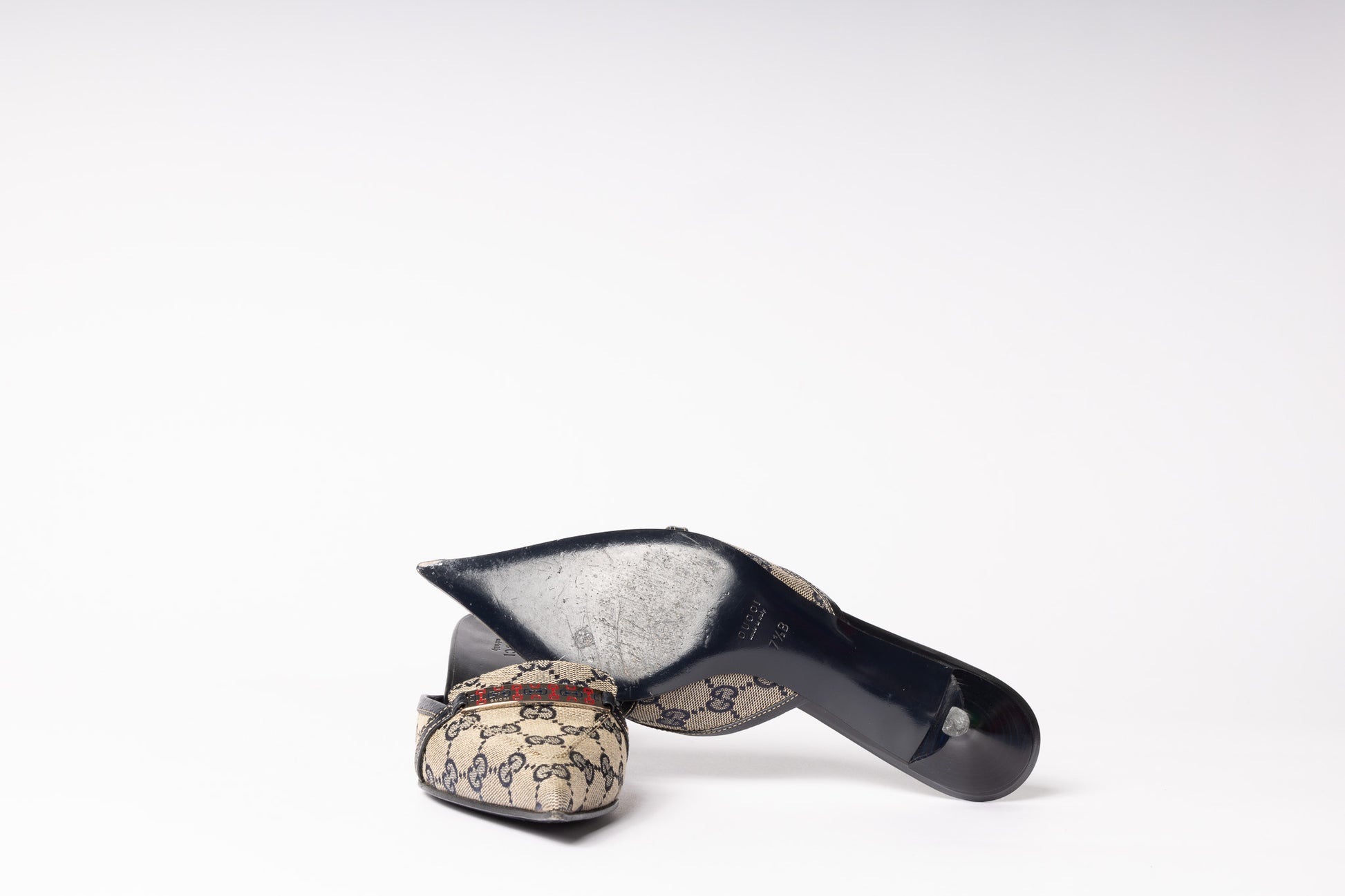Vintage Gucci Mules - Timeless allure and iconic elegance in luxurious footwear for a sophisticated fashion statement.