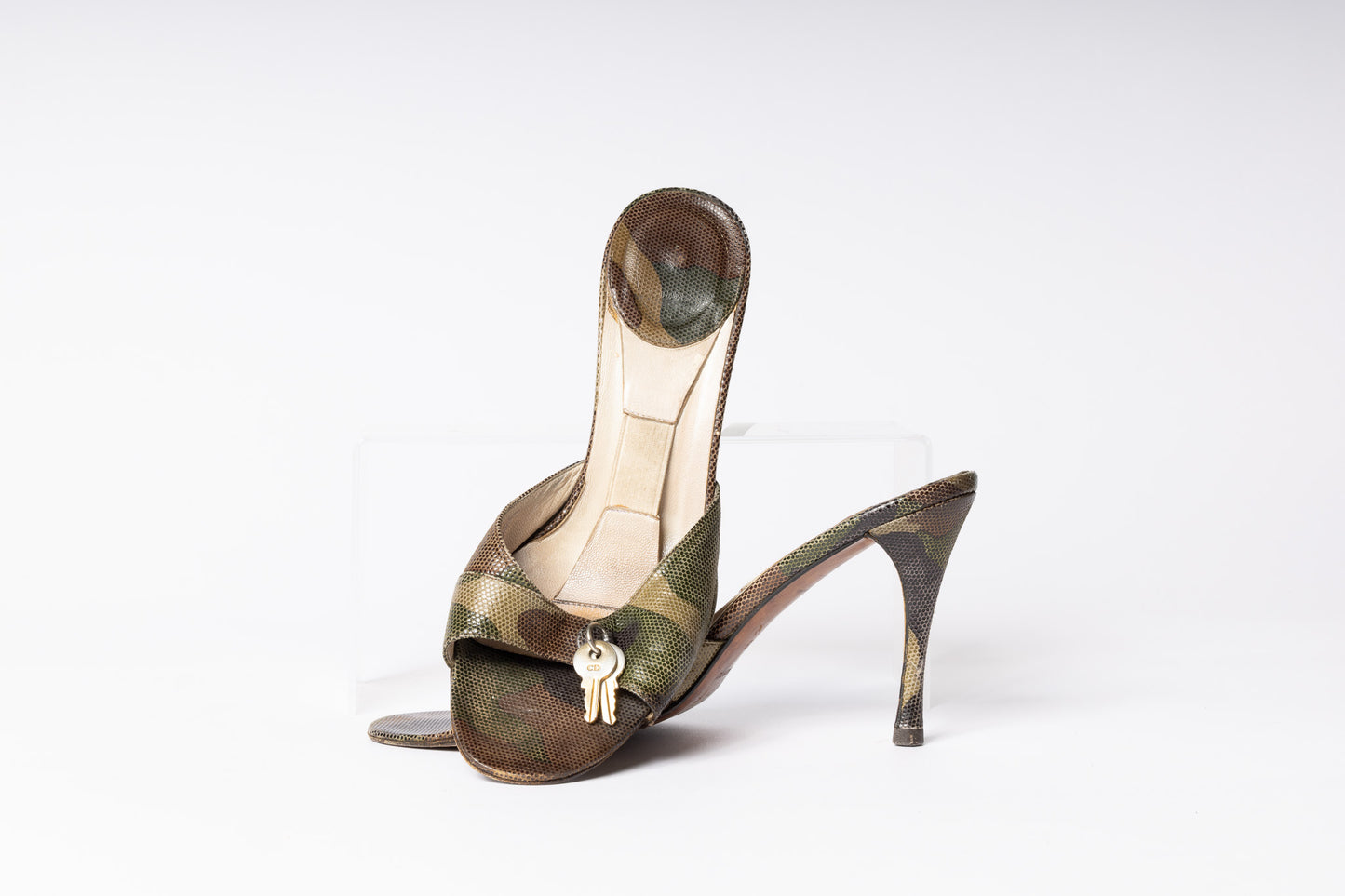 Step back in time with Vintage Dior Camo Heels. Unleash a retro charm and stand out with these iconic camo-patterned heels. 