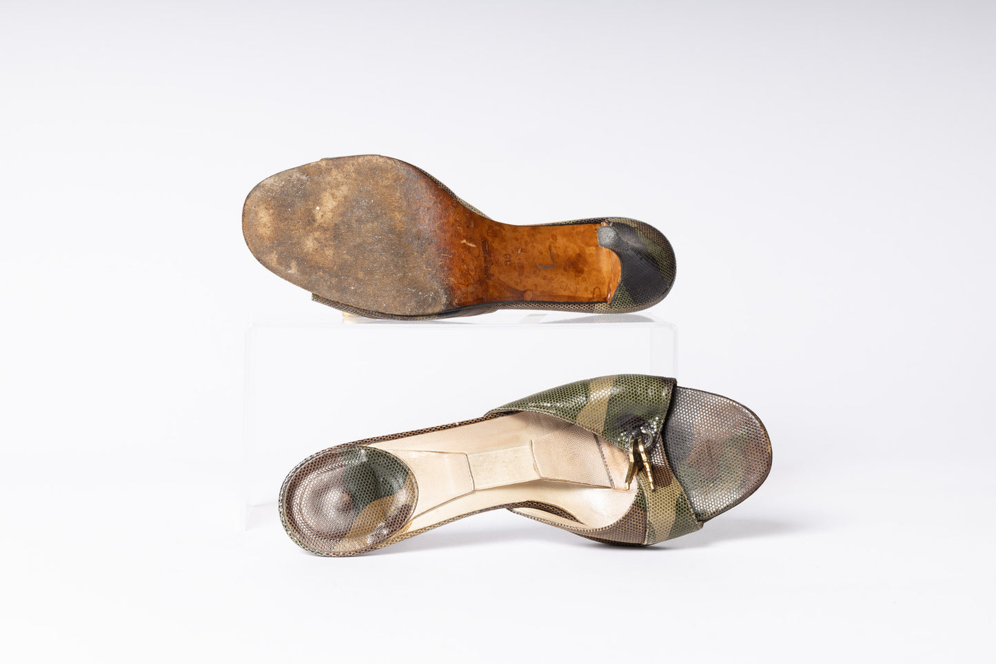 Step back in time with Vintage Dior Camo Heels. Unleash retro charm and style with these iconic camo-patterned heels.