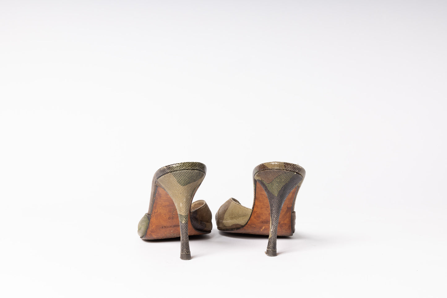 Vintage Dior Camo Heels - Embrace retro charm with iconic camo-patterned heels, exuding timeless style and elegance.