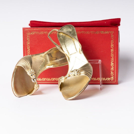 Step into luxury with Rene Caovilla Gold Heels. These exquisite heels bring glamour and sophistication to any ensemble.