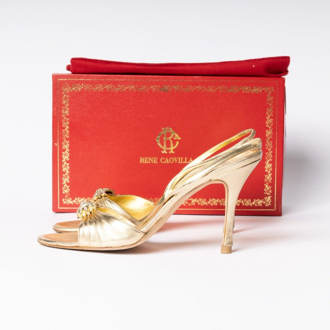 Rene Caovilla Gold Heels - Radiant glamour and timeless allure in a pair of stunning, statement-making shoes.