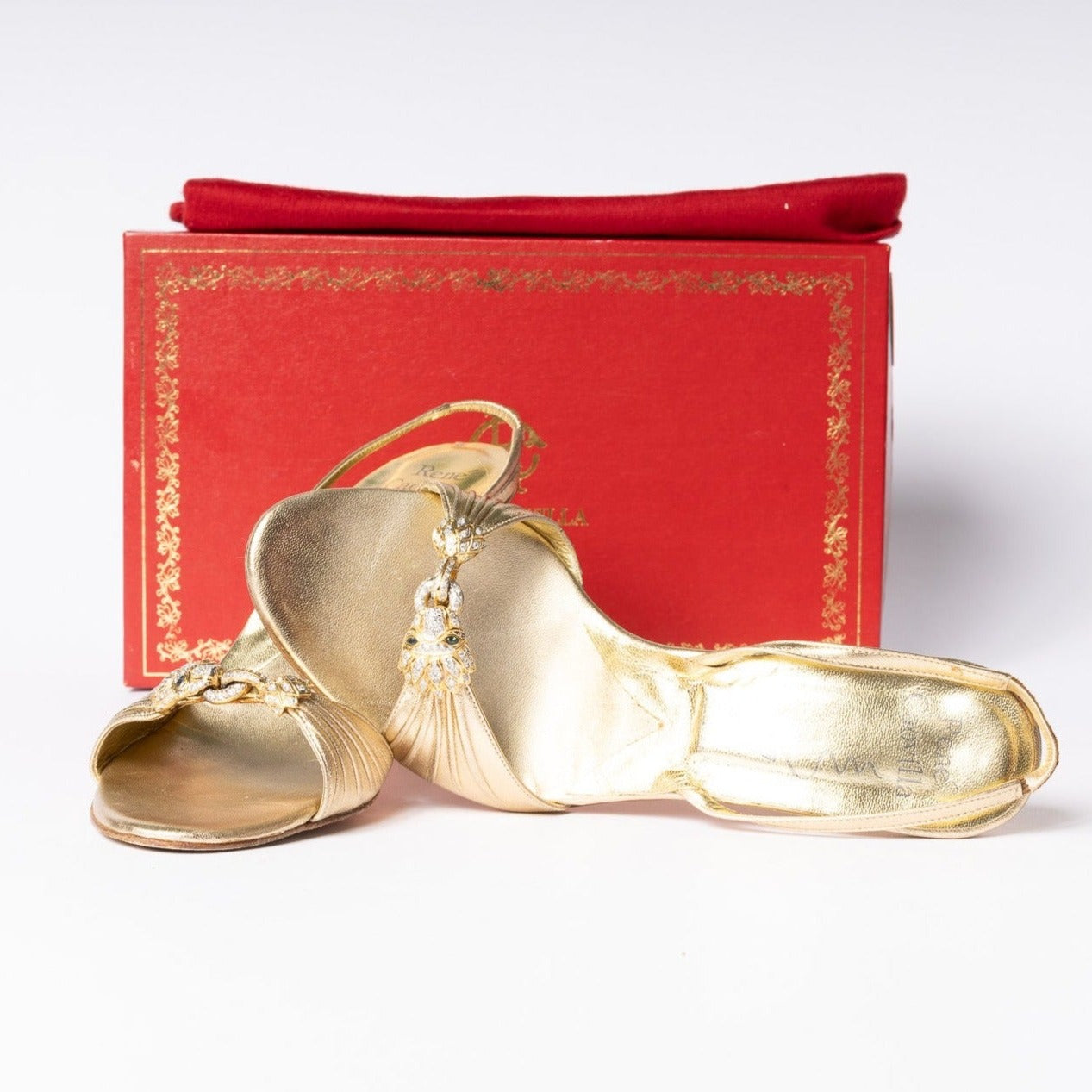Rene Caovilla Gold Heels - Embodied elegance and captivating shine for an unforgettable fashion statement.