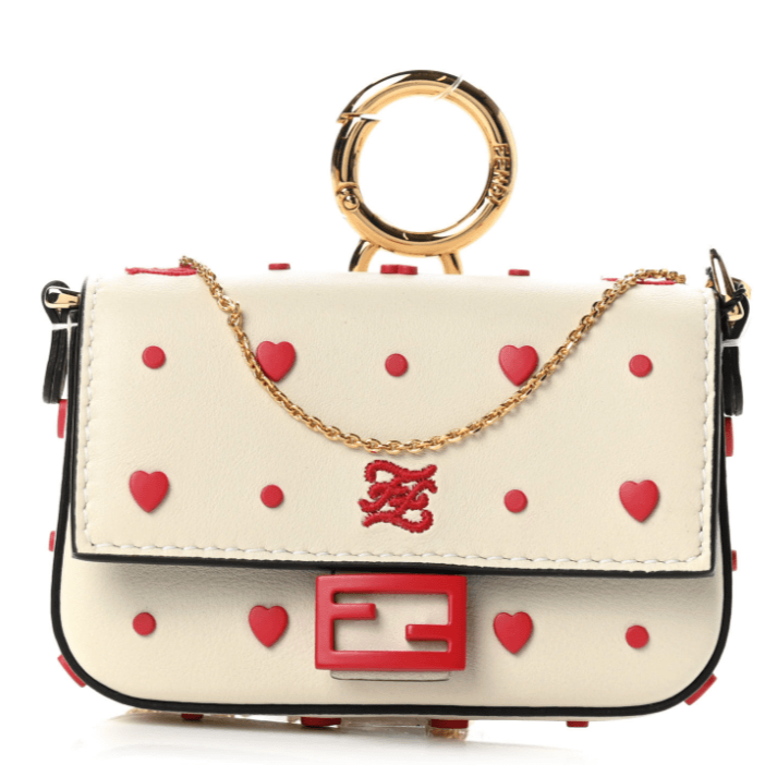Fall in love with the Fendi Micro Baguette Heart Bag. This adorable accessory combines style and charm. Shop now and steal hearts.