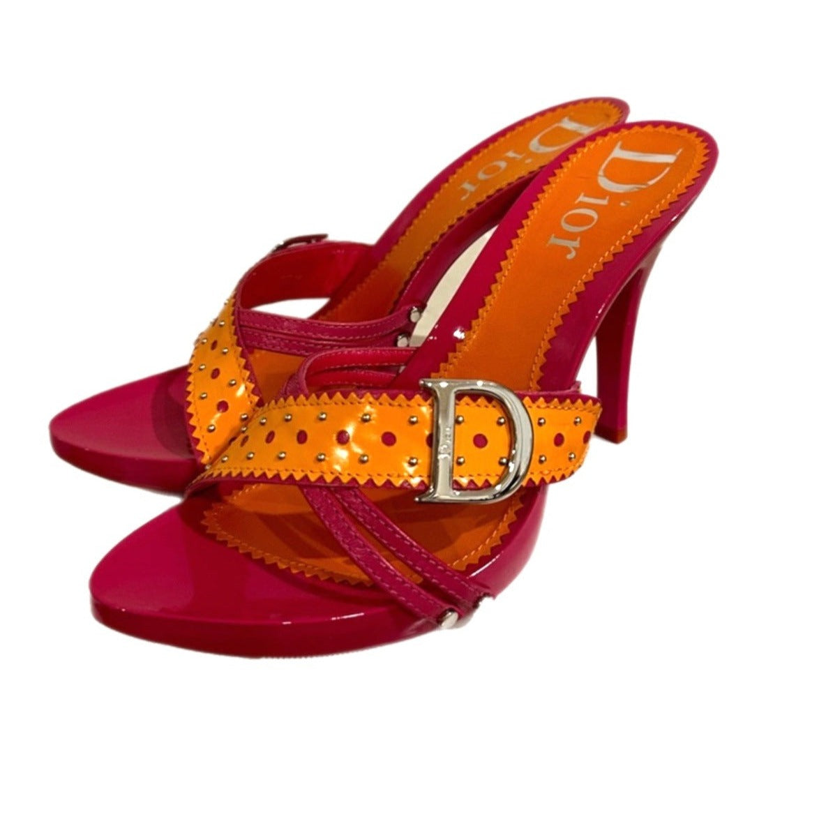 Step into retro elegance with Vintage Dior Pink & Orange Sandals. Embrace chic charm with these colorful, timeless heels.